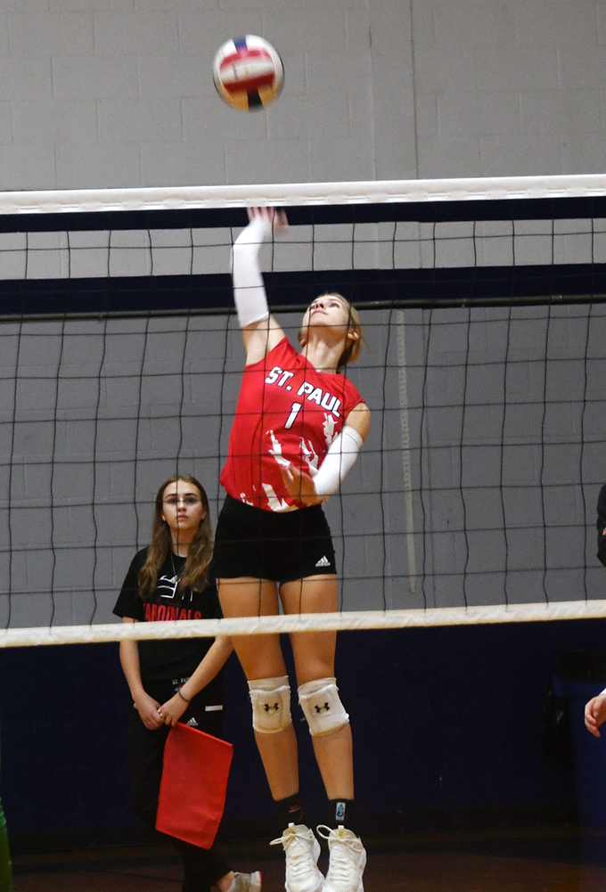 Riley Mozisek makes a hit at the net during St. Paul’s Rice Tournament game against Bloomington on Thursday. Photo by Mark Lube.