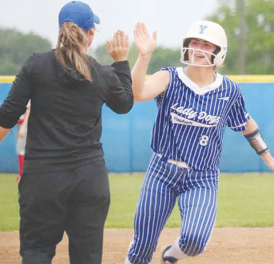 Yoakum High School Lady Bulldog Olivia Fojt gets a high-five from Coach Monica Chovanec after hitting a homerun. Contributed photo.