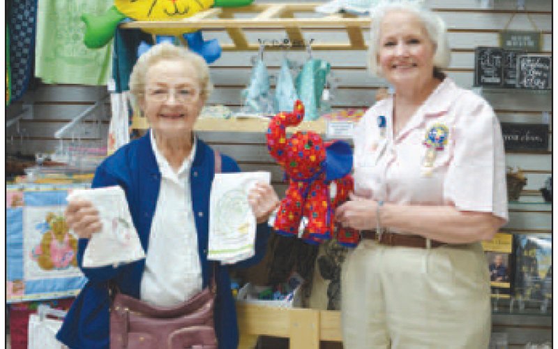 Pictured from left to right are Mary McQuillen and Nancy McNease of The Pink Ladies. They are holding handmade items available at Pink Hearts Gift Shop at the Yoakum Community Hospital.