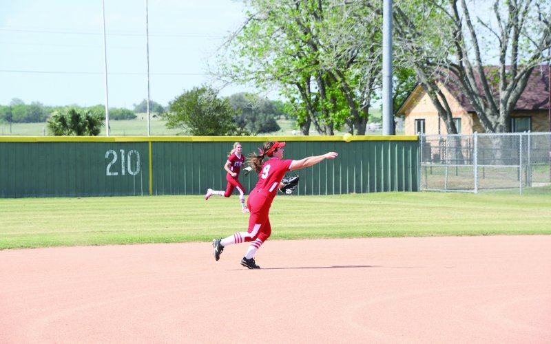 Second baseman Stefany Pokluda makes a throw to first base. Photo by Mark Lube.