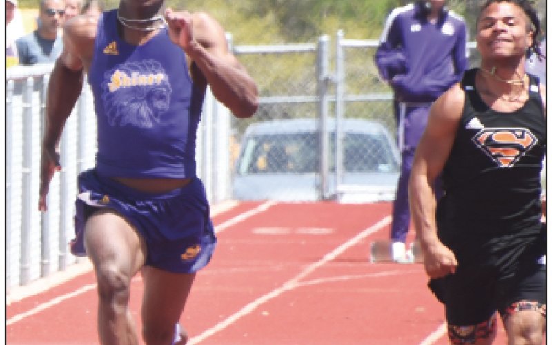 Dalton Brooks (left) won both the 100 and 200 as well as being a part of the first-place 800-relay team. Photo by Mark Lube.