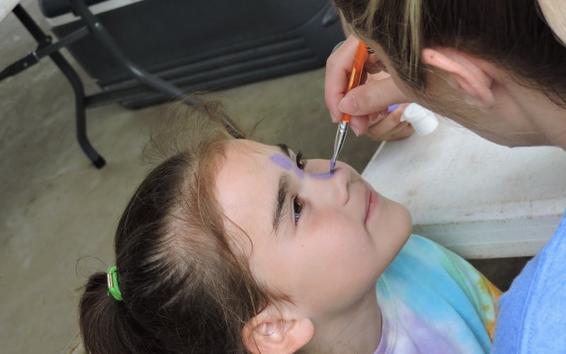 Rosalinda Arias gets her face painted at Green-Dickson Municipal Park during the RISE Reel Fishin event.