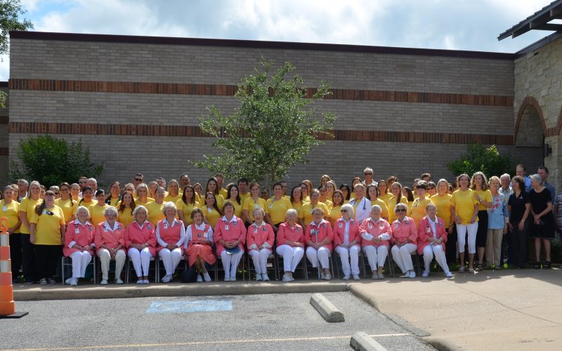 Yoakum Community Hospital staff, the Pink Ladies, City staff, City Council members, and other locals pose by the recently dedicated oak tree on Friday, May 13.