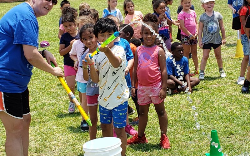 Students sprayed water guns and participated in other water-centered games outside of the Yoakum Primary Annex School on May 20.
