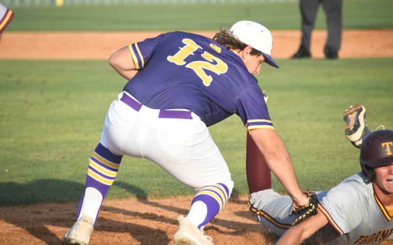 AJ Patek attempts to tag out a Bulldog base runner. Photo by Mark Lube