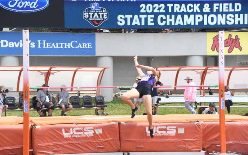 Chesney Machacek clears the bar on an attempt in the high jump. Photo by Mark Lube.
