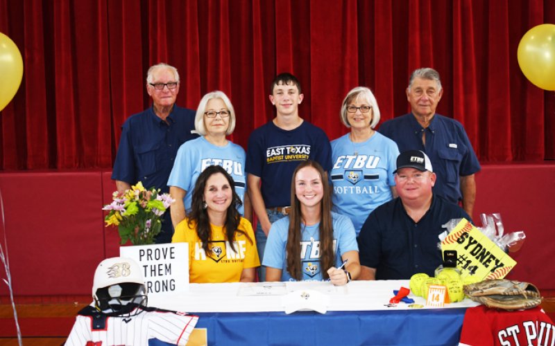 Senior Sydney Green signed with East Texas Baptist University for softball on Tuesday May 10. Seated from left, Tracy Green, Sydney Green and Darren Green. Standing from left, Donald Green. Bonnie Green, Garrett Green, Liz Mican and AJ Mican. Photo by Mark Lube.