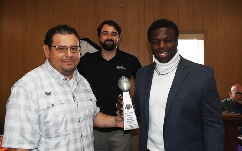 Whataburger Super Team Defensive Lineman. From left is Curt Harbers (Whataburger), Robert West (Dave Campbell's Texas Football) and Doug Brooks. Photo by Mark Lube.