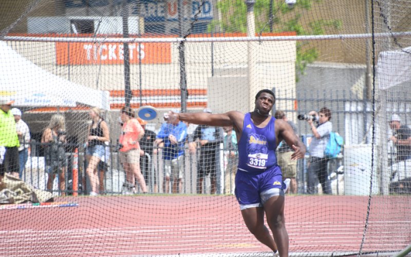 Doug Brooks releases the discus. He got second place and a PR. Photo by Mark Lube.