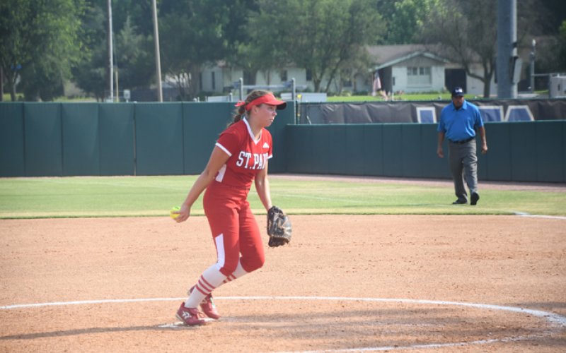 Junior Julia Machacek pitched a little  in both the state semifinals and final.Photo by Mark Lube.