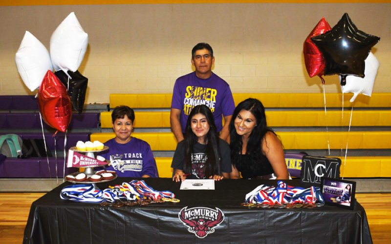 Jocelyn Moreon will run cross country and track at McMurry University. Seated from left is Gloria Moreno, Jocelyn Moreno and Maria Moreno. Standing is Araulfro Moreno. Photo by Mark Lube,
