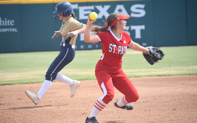 Stefany Pokluda with a throw towards first base in the state semifinal. Photo by Mark Lube.