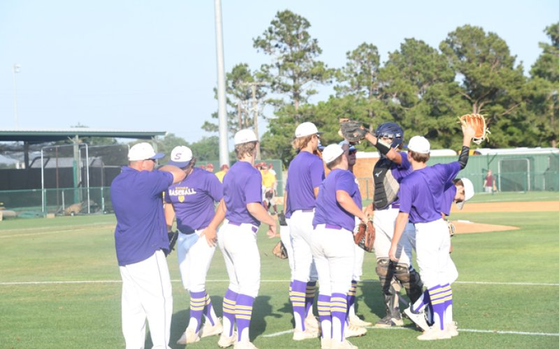 The Shiner Comanches have a short meeting before the game. Photo by Mark Lube.