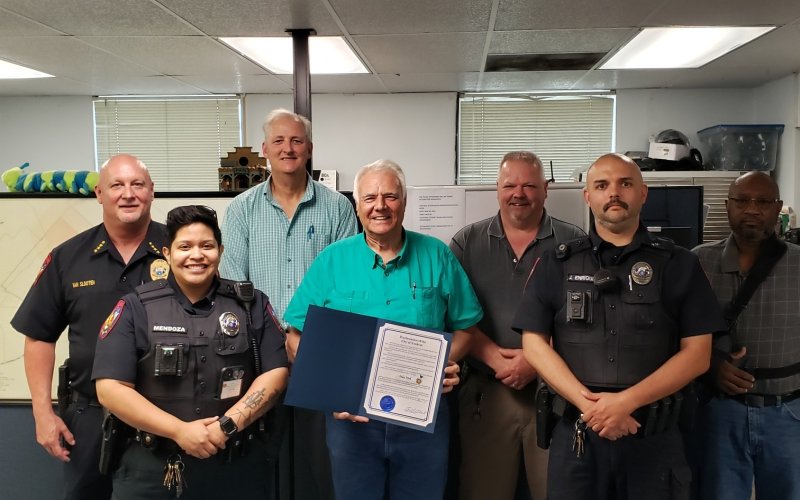 (Front from left) Sarah Mendoza, Mayor Carl O’Neill, John Enriquez, (Back from left) YPD Chief Karl Van Slooten, City Manager Kevin Coleman, Michael Pierman, and Leroy Brooks pose with the proclamation concerning Police Week.