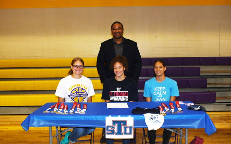 Lady Comanche swimmer Anaya Robinson will attend school in the Miami, Florda-area at St. Thomas University. Seated From left is Isis Robinson, Anaya Robinson and Cryah Robinson. Standing is Peter Robinson. Photo by Mark Lube.