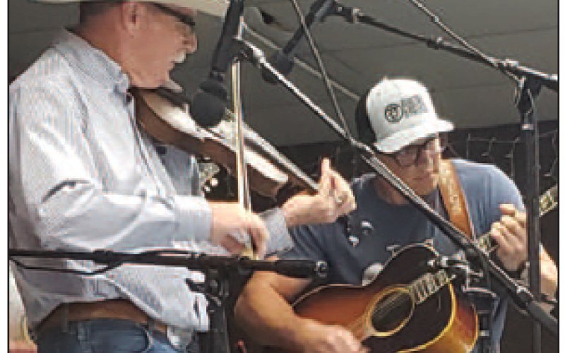 Hopkins performing with his son Hyatt Hopkins on the guitar.