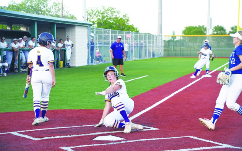 Alaya Boedeker slides into home plate in the second inning. She finished with one run. Photo by Mark Lube.