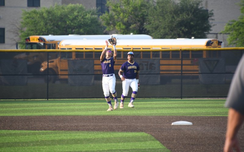 Shortstop Drew Wenske catches a fly ball with left fielder Keenan Hailey providing backup Thursday evening against Bremondin Game one.. Photo by Mark Lube