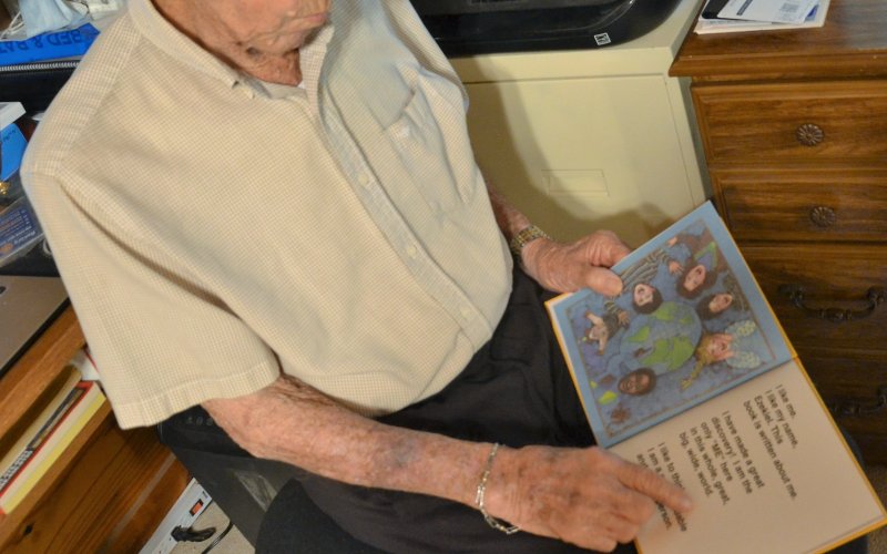 Bill Lopez reads from I LIKE ME, a familiar book to many long-time Yoakum ISD students. Photo by Hans Lammeman