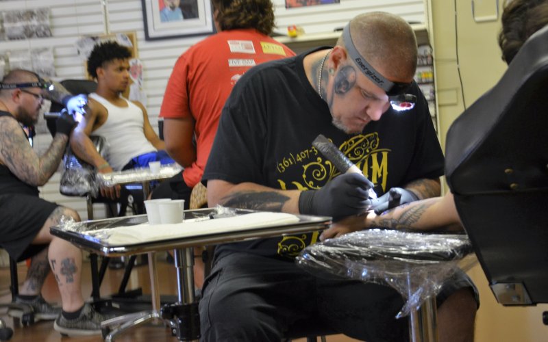 Trey Harris and Josh Fluitt tattoo guests at Yoakum Ink Friday, June 10.