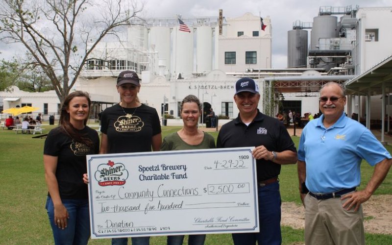 Becky Janak, Program Manager of CCLC (center), accepted the donation and is pictured with brewery team members Lauren Schuette, Julie Boehm, Tom Fiorenzi and Jimmy Mauric.
