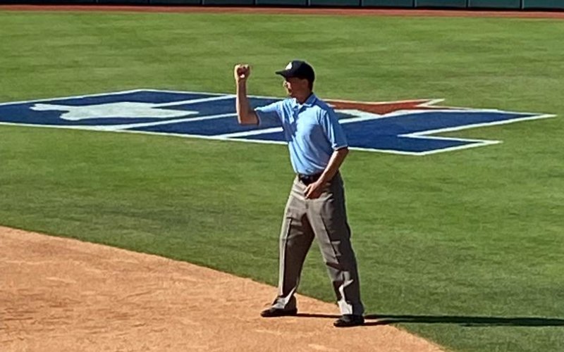Robert Klekar indicates an out call during the Class 1A state championship game between Hermleigh and D'Hannis played Wednesday, June 1 at Red and Charline McCombs Field in Austin