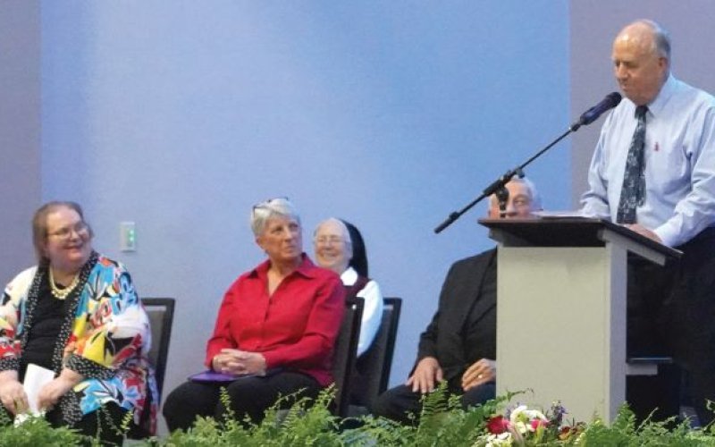 David Smolik shared a few stories, a few laughs and an awful lot of admiration for his good friend, Monsignor John. Photo by Janet Jones/The Catholic Lighthouse