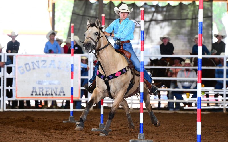 Audrey Thibodeaux of Shiner and her horse Pixie focus on the course.