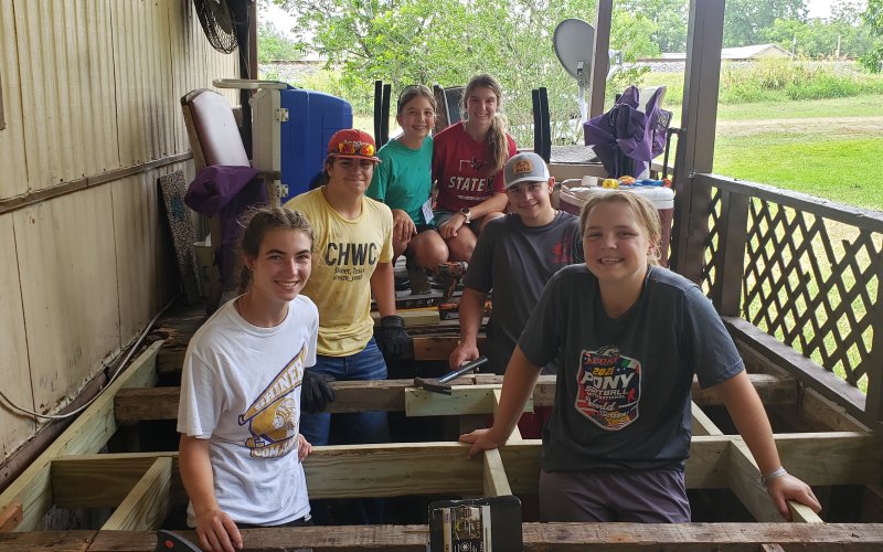 Lauren Faldyn, Kailey Boedeker, Nate Boedeker, Jacob Seibert, Sally Machcek and Brooke Cerny pose for a quick photo op Wednesday afternoon at their jobsite. They were just a few of the 60 kids participating this year in Shiner.