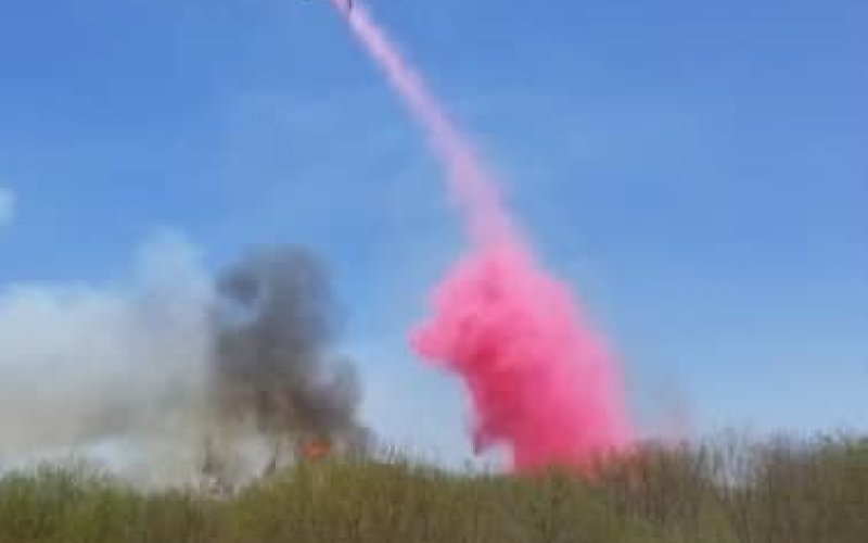 A single-engine aircraft tanker (SEAT) assists with a large grass fire impacting Colorado County this week. Photo Courtesy Columbus Fire Department.