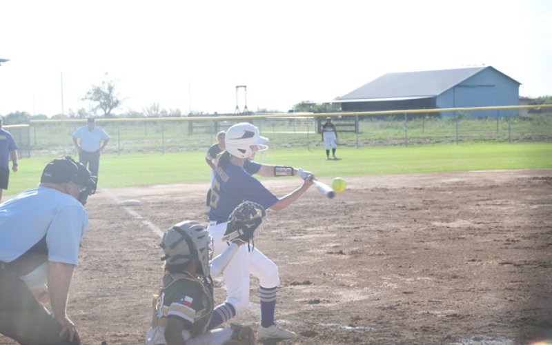 Ebey Johnson makes contact at the plate during Shiner’s second game vs Rockport-Fulton on Friday. Photo by Mark Lube.