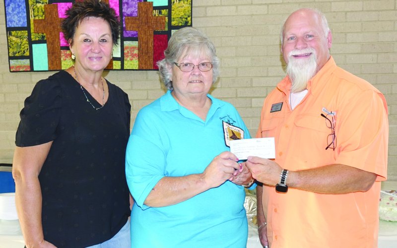 Pictured are, left to right, FUMC secretary Mary Kristynik, Shiner Heritage Quilters President Janet Ferguson and Pastor Darin Zumwalt.