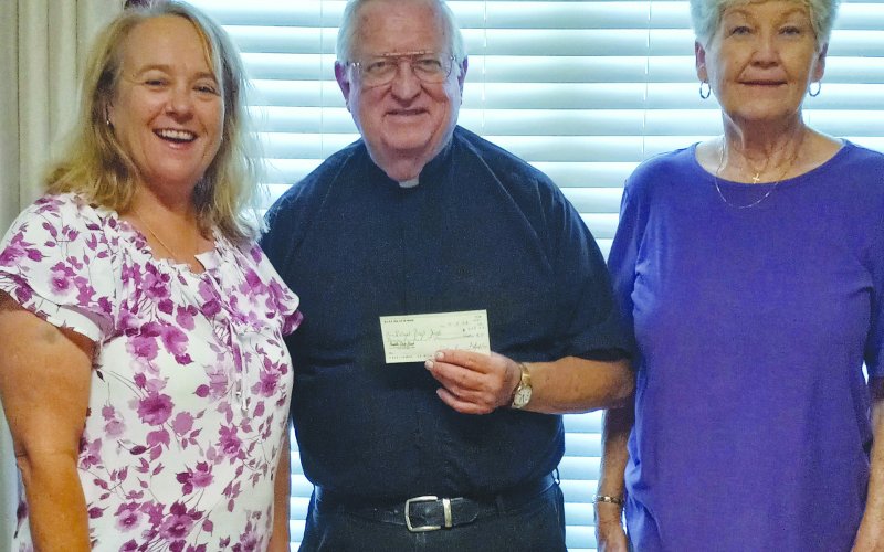 Pictured are, left to right, Monica Peters, Msgr. John Peters and Helen Janak.