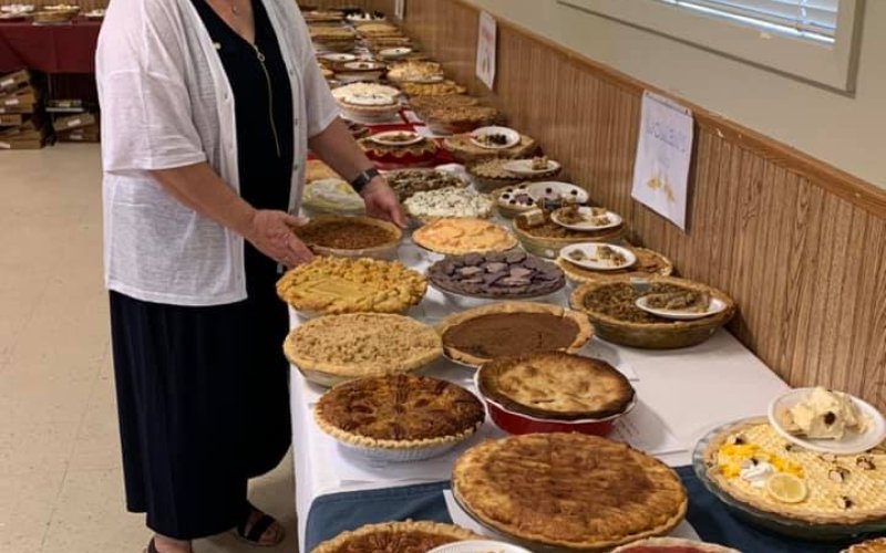 Mrs. Helen Chaloupka and one fine collection of pies from the judging room.