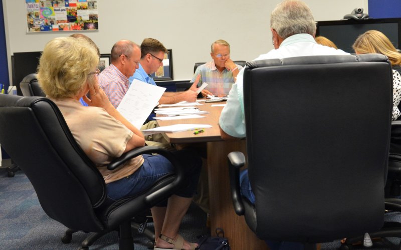 YISD trustees and administrators review budget information during the Aug 1 budget workshop in the YISD Administration Building. Photo by Hans Lammeman.