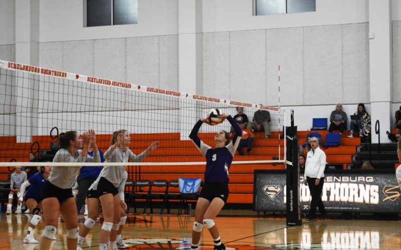 Rylee Vancura sets a ball Friday against Victoria St. Joseph. Photo by Mark Lube.