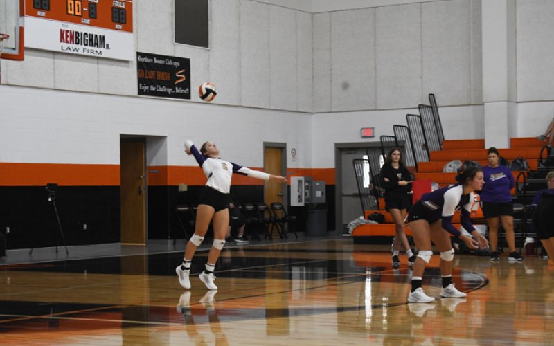 Callie Sevcik with a serve during a match on Friday. Photo by Mark Lube.
