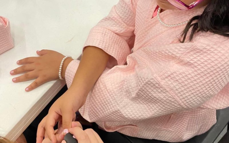 Contestant Sylvia Izaguirre gets her nails painted before the Miss Sparkle pageant AUg. 14.
