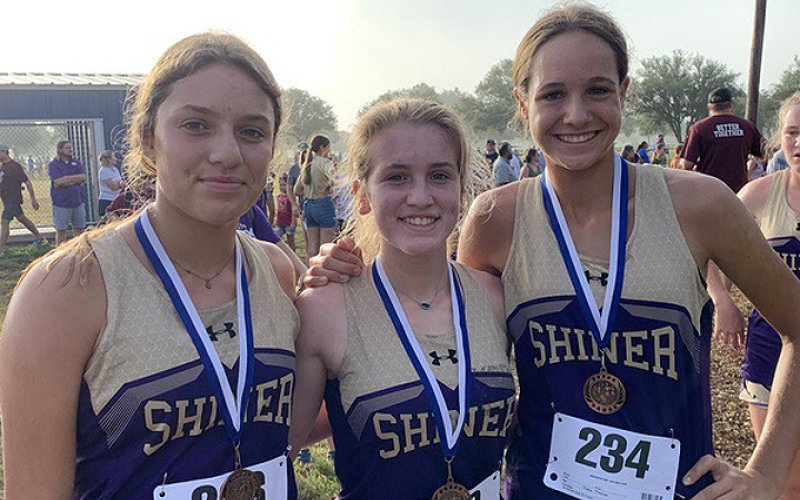 Lady Comanche medalists from left is Brinley Ramire, Hayleigh Burns and Erin Pustka. Photo courtesy of Michelle Winkenwerder.