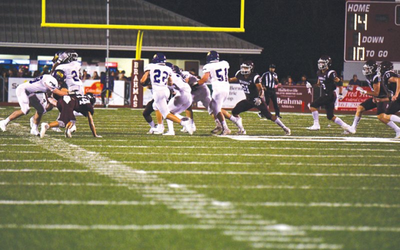 Shiner running back Beck Bishop carries the football in the Comanches’ opener Friday night at Hallettsville. Photo courtesy of Chuck Grafe/Hallettsville Tribune-Herald.
