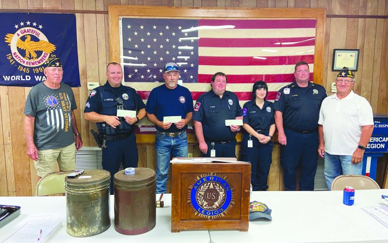 Pictured are, left to right, David Muehlstein, James Whited, Jason Shows, Tyler Havel, Abby Pulatie, John Schultz, and Commander Jimmy Strait.