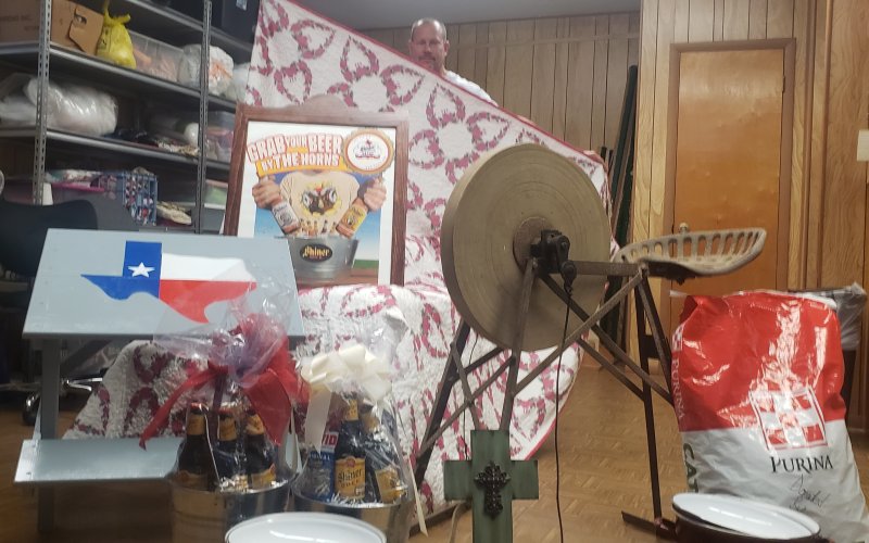 Deacon Michael Morkovsky helps us display a sampling of the many fine wares in Sunday’s noon auction, including hand stitched quilts, Shiner beer collectibles, antiques, furniture and all sorts of other great items. Head over to the Shiner KC Park, 102 S. Ave. G, for a whole day of fun. See you there! 