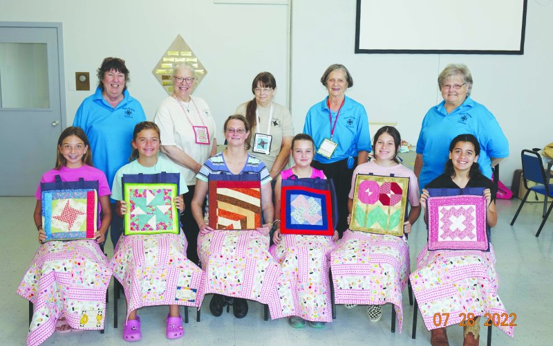 Pictured are students, seated, left to right, Sally Machacek (Shiner), McKenzie Kesler (Flatonia), Tara Raskob (Shiner), Markie Egan (Shiner), Clara Kinney (Flatonia), and Penny Rouse (Windcrest). Standing are guild members, left to right, Janet Zabransky, Mary Shafer, Kathy Riske, Irene Cerny and Janet Ferguson. Guild Members not pictured who assisted are Gladys Muehlstein, Rose Mary Havlik, Beni Gerdes, Carolyn Janak, Bernadette Kresta, and Debbie Novosad. Photo by Gene Cerny