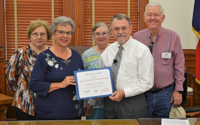 (Back from left) DeWitt County Historical Commission Vice Chairman Dianna Bartosh, Boardmember Barbara Nuckles, Boardmember Larry Nuckles, (Front from left) and Chairman Peggy Ledbetter receive the THC 2021 Distinguished Service Award presented by County Judge Daryl Fowler Monday, Sept. 26. Photo by Hans Lammeman.
