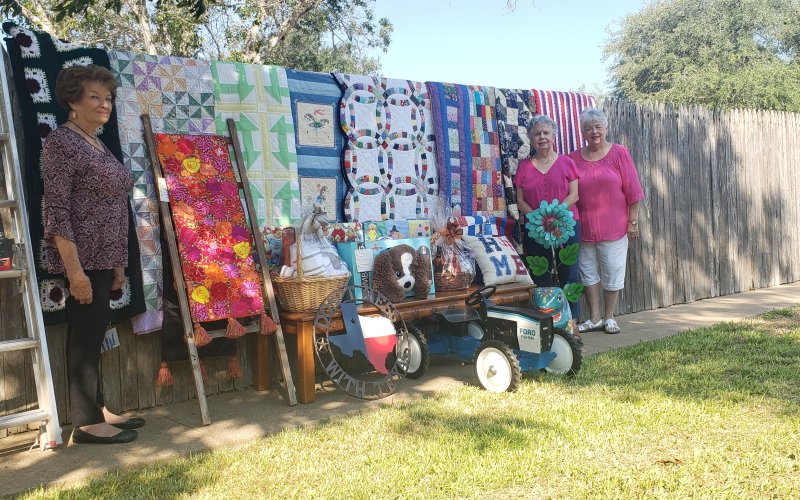 Pictured with just a few of the great items that will appear in Sunday’s action are, from left, Rose Selzer, Joyce Pavlicek and Gussie Machalec.