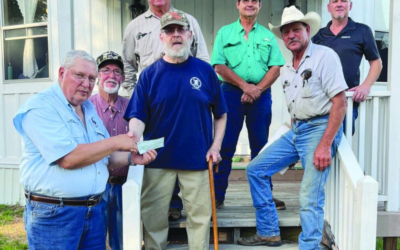 Pictured accepting the donation are Lavaca County 4-H Shooting Sports Volunteer Instructors Phil Guenther, Curtis Henrichs, Alan Rother, Andrew Marcak, Wayne Rother and Kevin Kubenka. Donor Warren Peloquin is pictured in the center.