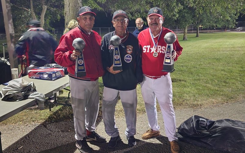 E.L Moore (far right) and teammates pose with the NAFA World Series trophies Sept. 11.