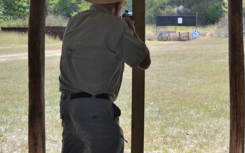 Norbert “Buck” Henneke aims at a target 100 yards away at  Appelt’s Hill Gun Club, Oct. 16.