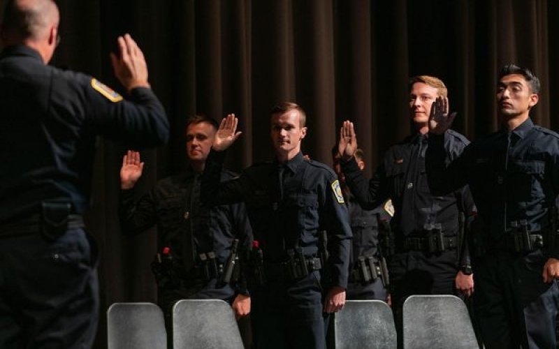 Matthew Herman accepts his oath as new police officer with the Bryan Police Department having recently completed Police Academy.