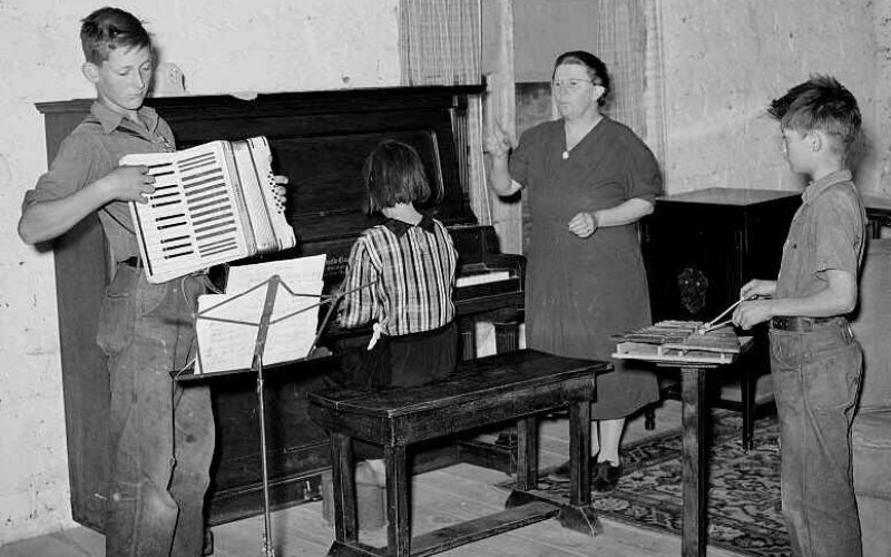 Historic Photo: The WPA was more than just constriction jobs. There wete big parts that focus on art and murals at various cities. Libraries were built and filled WPA dollars, and music programs would pay teachers a stipend and provide free instruments and music to students learn to play through much of the 1940s.